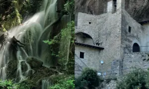 Cascate di pale in una foresta lussureggiante e un antico eremo in pietra incastonato nella roccia.