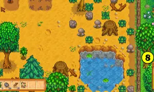 Stardew Valley poradnik: farma z drzewami, kamieniami, stawem i ikoną "8".