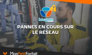 Un technicien examine des câbles réseau avec le logo Bouygues Telecom et un panneau d'alerte.