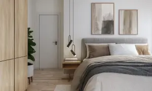 Ett modernt och vackert sovrum med en stor säng, trägarderob, dörr och konst på väggen.