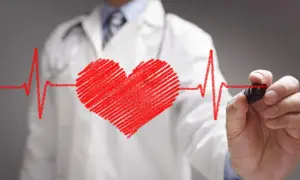 Lekarz rysuje serce i linię EKG. Może to symbolizować troskę o zdrowie serca, a nawet pomoc w radzeniu sobie ze stresem, jak Nebilet na uspokojenie.