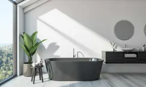 A modern bathroom with a dark grey bathtub, large window, and plant. This image might inspire ideas on how to paint a bathtub for a sleek look.