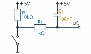 Schemat filtru RC: rezystor R1 (10kΩ), rezystor R2 (1kΩ), kondensator C1 (100nF) i przełącznik podłączone do +5V i masy.