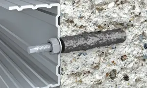 Przekrój pokazuje, jak kotwy chemiczne mocują profil aluminiowy do betonu. Solidne i niezawodne rozwiązanie.