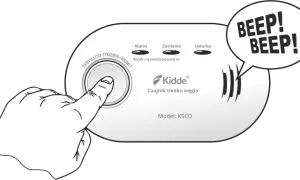 Dłoń naciska przycisk czujnika czadu Kidde, który sygnalizuje alarm dźwiękiem "BEEP! BEEP!".