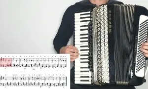 Akordeonista gra znane utwory na akordeon, widoczna partytura z nutami.