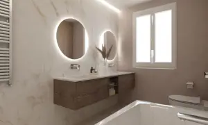 Bagni eleganti con pareti in marmo, doppio lavabo con specchi rotondi illuminati, mobile sospeso in legno e vasca da bagno.
