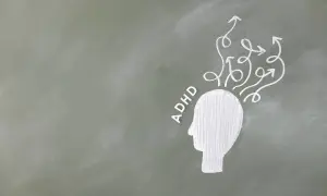 Biały zarys głowy z napisem ADHD i chaotycznymi strzałkami wychodzącymi z niej, symbolizującymi gonitwę myśli u dorosłych.
