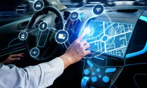 Ręka Adama dotyka ekranu nawigacji w samochodzie przyszłości. Ikony symbolizują funkcje smart car.