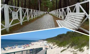 Ścieżka przez las z białym płotem i ławką prowadzi do plaży. Międzywodziu atrakcje to idealne miejsce na wypoczynek.