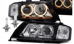 Nowe lampy do Audi A6 C5 z ringami i żarówkami.