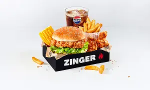 Pyszny Zinger Box z burgerem, kurczakiem, frytkami, kukurydzą i Pepsi. Idealny zestaw, by zaspokoić głód i sprawdzić zinger kcal.