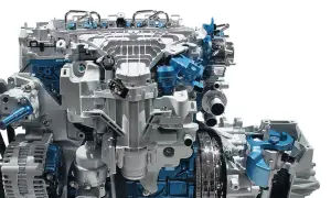 Silnik Ford Mondeo MK6, z widocznymi elementami układu paliwowego i alternatora, w kolorach białym i niebieskim.