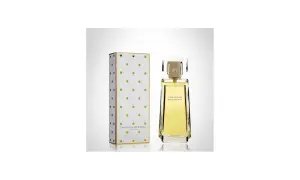 Eleganckie perfumy Carolina Herrera w złotym flakonie i pudełku w kropki.