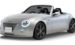 Srebrny kabriolet Daihatsu Vision Copen z okrągłymi światłami i sportowymi felgami.