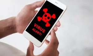 Telefon wyświetla czerwony symbol czaszki i napis "VIRUS ALERT!". Dowiedz się, jak usunąć wirusy z telefonu, aby uniknąć problemów.