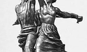 Rzeźba robotnika i kołchoźniczki, symbol pracujących ludzi. Ich dłonie unoszą narzędzia pracy, symbolizujące hasło "sierp i młot".