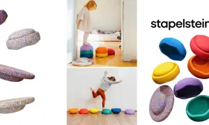 Bunte Stapelsteine regen Kinder zu kreativen Spielideen an. Kinder balancieren und stapeln die bunten Steine.