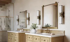 Two elegant wall sconces illuminate each side of the mirrors above the 72-inch vanity, creating a balanced and luxurious bathroom ambiance.