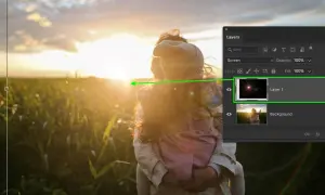 Effetto lens flare in Photoshop su un tramonto con due persone.
