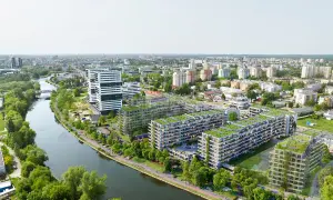 Nowoczesne osiedle apartamentowe z zielonymi dachami nad rzeką w Bydgoszczy.