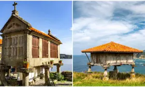 Dos hórreos, uno de piedra con cruz y otro de madera, se alzan sobre pilares en la costa de Asturias.