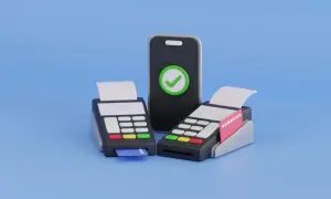 Zwei Kartenlesegeräte und ein Smartphone mit Häkchen-Symbol stehen für bargeldlose Zahlung.