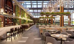 Interior de restaurante moderno con barra, mesas y vegetación. Un lugar así podría costar mucho, pero ¿cuanto cuesta abrir un restaurante?