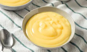 Crème anglaise on a striped cloth, a comforting dessert like crème anglaise recette grand-mère.