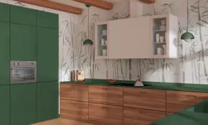 Nowoczesna kuchnia z zielonymi frontami i drewnianymi szufladami. Ściany zdobi subtelna tapeta z motywem bambusa.