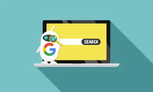 Robot z logo Google szuka czegoś na ekranie laptopa. To pokazuje, google co to jest - wyszukiwarka.