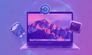 Kosz na śmieci i klawisz terminala unoszą się obok laptopa z górskim krajobrazem na ekranie. Wszystko wygląda jak ostatnio usunięte.