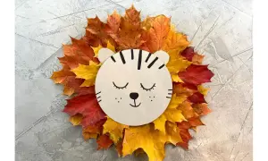 Süßer Löwe aus bunten Herbstblättern, ein tolles Bastelprojekt für Kinder.