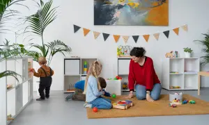 Children engage in independent play, exploring toys and learning materials, embodying the Montessori approach to play.