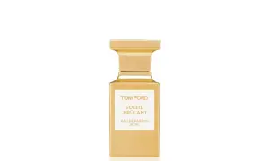 Złota butelka perfum Tom Ford Soleil Brûlant, emanująca ciepłem i luksusem.