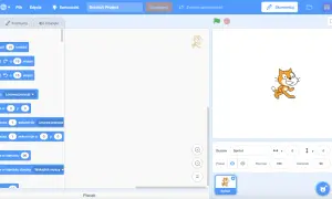Scratch to środowisko do tworzenia gier i animacji. Na ekranie widać blok "Ruch" z opcjami, jak "Przesuń 10 kroków" i "Obróć".