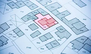 Mapa działek z zaznaczonym obszarem 115. Może to oznaczać zmianę w księdze wieczystej lub planowane inwestycje.