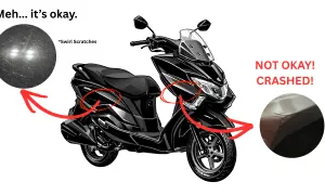 Czarny skuter z widocznymi uszkodzeniami. Sprawdzenie motocykla przed kupnem ujawnia drobne rysy i poważne pęknięcia po upadku.