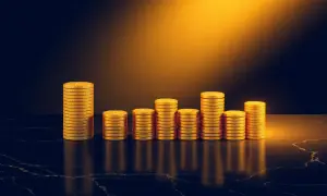 Staplar av guldmynt som visar en stigande trend, som symboliserar nya 3 12 regler och finansiell tillväxt.