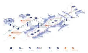 Plan de l'aéroport Roissy-CDG montrant les terminaux, les navettes, les trains RER B et les hôtels. La distance Roissy Paris centre est indiquée.
