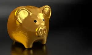Złota skarbonka symbolizuje mądre inwestycje w złoto.