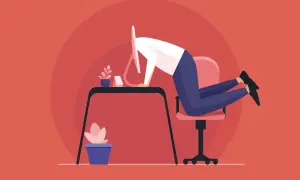 Pracownik z głową w monitorze, symbolizujący przytłoczenie pracą i potencjalną szkodliwość toluenu dla zdrowia psychicznego.