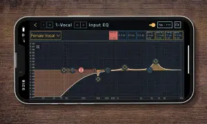 Ekran iPhone'a z aplikacją do edycji dźwięku, pokazującą korektor graficzny dla "Female Vocal". Czy słuchawki JBL łączą się z iPhonem?