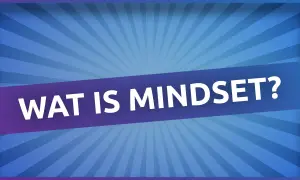 Een ander woord voor mindset is instelling. De tekst "WAT IS MINDSET?" staat op een paarse band tegen een blauwe achtergrond met stralen.