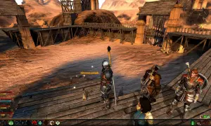 Postacie z Dragon Age 2 DLC na pustynnej platformie.