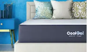 A CoolGel memory foam mattress on a bed with decorative pillows. Is memory foam safe? Yes, this mattress offers safe, comfortable sleep.