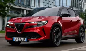 Czerwony SUV Alfa Romeo na drodze, jeden z najlepszych SUVów, z nowoczesnym designem i sportowym charakterem.