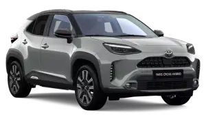 Srebrny Toyota Yaris Cross Hybrid 2025 z czarnym dachem, nowoczesnymi światłami LED i masywnymi zderzakami.