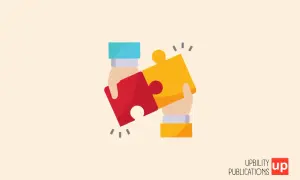 Due mani uniscono due pezzi di puzzle, simboleggiando l'unione e la comprensione per la sindrome di Down e l'autismo.