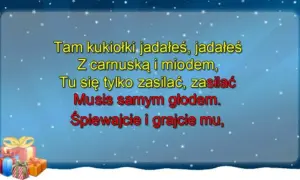 Golec uorkiestra śpiewa "oj, maluśki, maluśki tekst" na tle zimowego nieba z prezentami.